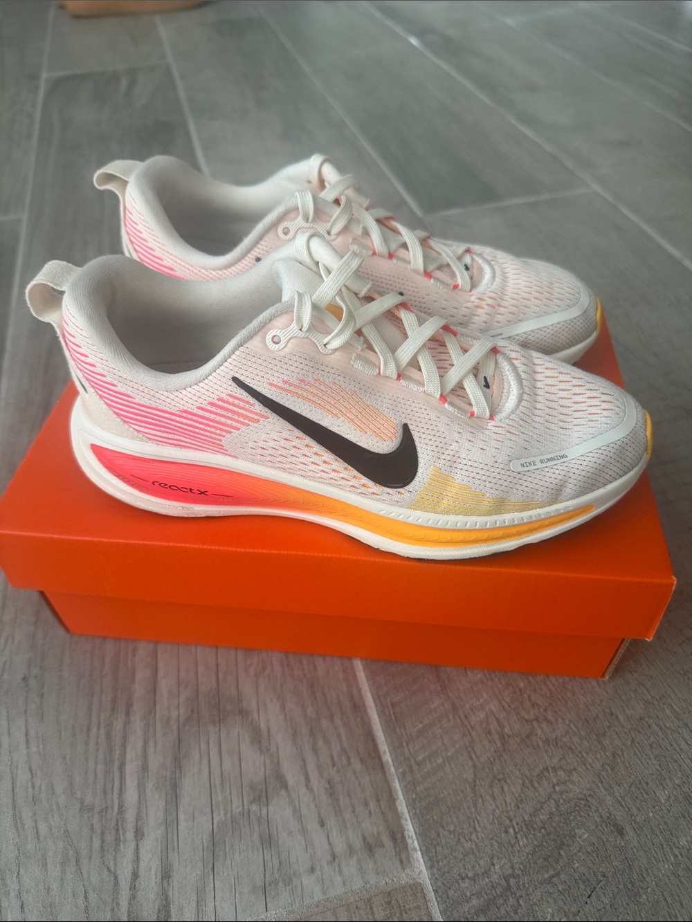Nike Girl's White Running Shoes with Pink and Orange Gradient Accents